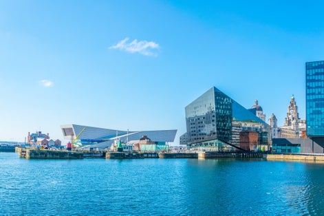 Photo of waterside of Liverpool dominated by the museum of Liverpool, England.