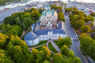 Early autumn morning panorama of the Port of Turku, Finland, with Turku Castle at background.