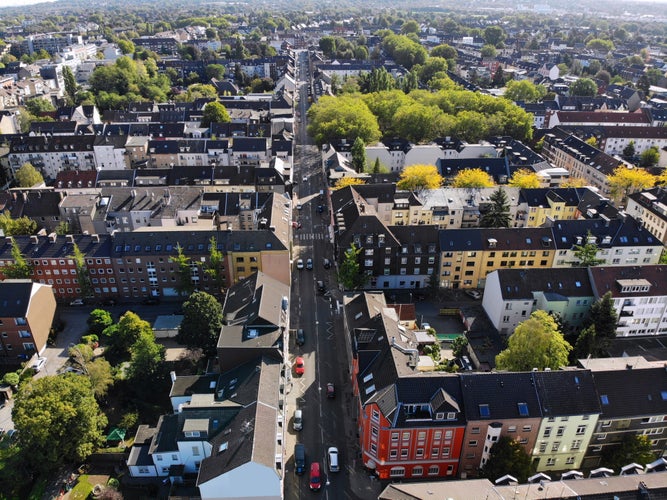 Photo of aerial view of streets and residential architecture of Oberhausen city in Germany. 