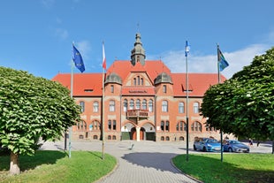 Photo of Lednice Chateau with beautiful gardens and parks on a sunny summer day, Czech Republic.