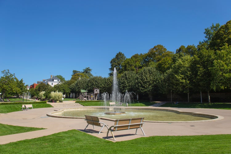 Photo of La Roche Sur Yon, Bayard Square with a fountain and a blue sky, France.