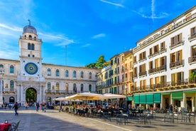 Photo of beautiful view of canal with statues on square Prato della Valle and Basilica Santa Giustina in Padova (Padua), Veneto, Italy.