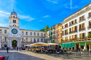 Photo of beautiful view of canal with statues on square Prato della Valle and Basilica Santa Giustina in Padova (Padua), Veneto, Italy.