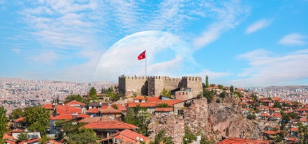 Hot air balloons flying over Uchisar Castle. Cappadocia. Nevsehir Province. Turkey.