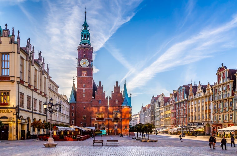 Photo of colorful evening scene on Wroclaw Market Square with Town Hall. Sunset in historical capital of Silesia, Poland.