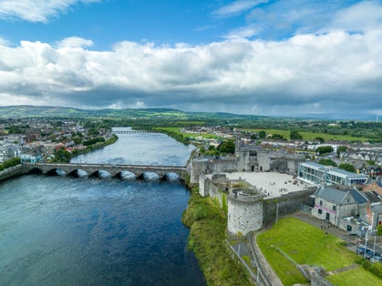 photo of view of  13th century King Johns Castle in Limerick by the Shannon river, Ireland.