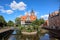 View from the front of the Millers' Guild house and the Radunia Canal in Gdansk, Poland on a blue sky summer day