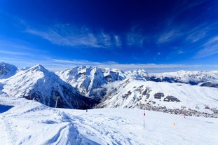 Photo of aerial view of spectacular winter landscape and mountain ski resort in French Alps ,Alpe D Huez, France.