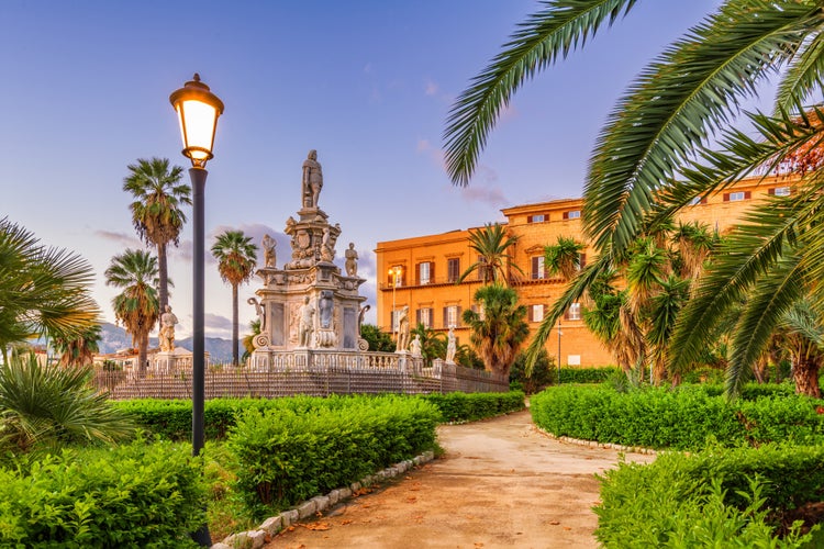 Photo of Villa Bonnano public gardens and the palace at dawn.