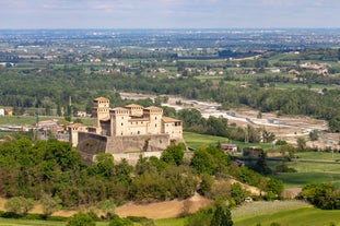 Photo of panorama of Parma cathedral with Baptistery leaning tower on the central square in Parma town in Italy.