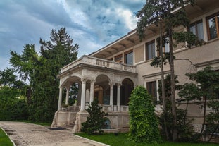 Antique building view in Old Town Bucharest city - capital of Romania and Dambrovita river. Bucharest, Romania, Europe.