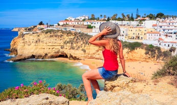 Photo of Carvoeiro fishing village with beautiful beach and colourful houses, Portugal.