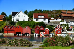 Photo of landscape with mountains, river and buildings in Lillehammer town, Norway.