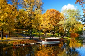 Photo of beautiful old town houses and church panorama with lake reflection in summer morning in Talsi, Latvia.