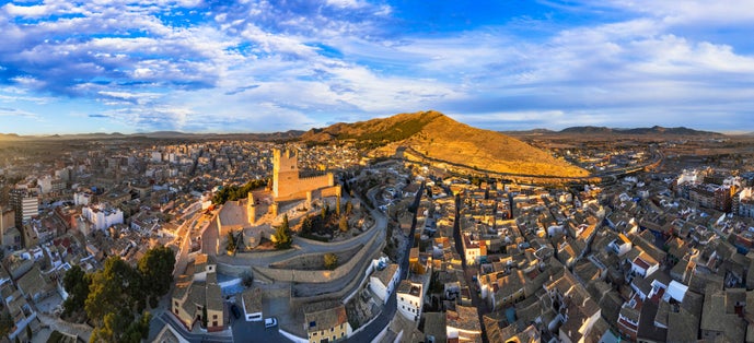 Photo of Scenic medieval towns and castles of Spain - Castillo de la Atalaya, Alicante province. Aerial drone panoramic view.