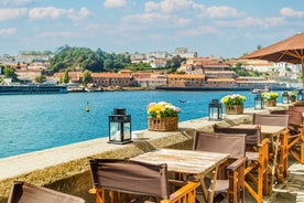 Porto, Portugal old town ribeira aerial promenade view with colorful houses, Douro river and boats.