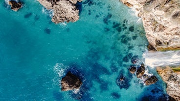 Photo of aerial view of the town of Nerja with the beautiful beach, Málaga, one of the white villages of Andalusia, Spain.