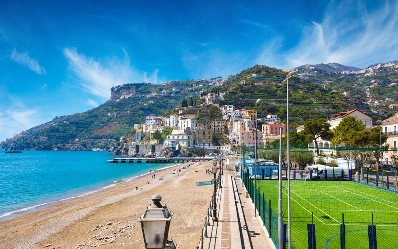 photo of view of  Blue sea and beach in Minori, seaside town at Amalfi Coast, province of Salerno, in Campania region of south-western Italy. Amalfitana is most popular travel and holiday destination in Europe