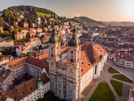 View of the Old Town of Basel with red stone Munster cathedral and the Rhine river, Switzerland.