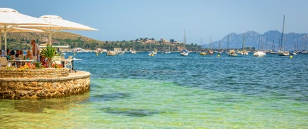 Photo of aerial view of the harbour of Port de Pollença, a seaside village located on the northern coast of Mallorca in the Balearic Islands, Spain.