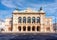 Photo of Vienna State Opera house in Austria on a sunny day.