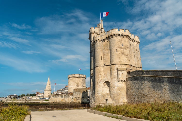 Photo of the beautiful fort and Saint Nicolas Tower of La Rochelle in summer.