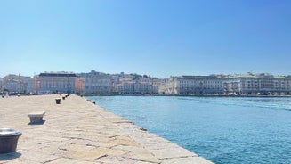 Photo of Trieste lighthouse Phare de la Victoire and cityscape panoramic aerial view, Friuli Venezia Giulia region of Italy.