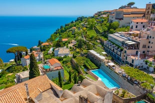 Photo of aerial morning view of Amalfi cityscape on coast line of Mediterranean sea, Italy.