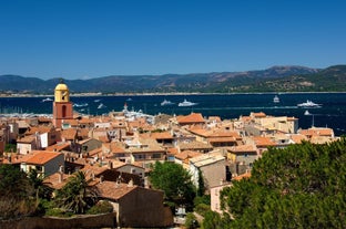 Photo of beautiful aerial view of Saint-Tropez, France with seascape and blue sky.