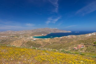 Photo of panoramic aerial view of the popular Platis Gialos beach on the Greek island of Mykonos with turquoise sea, Greece.