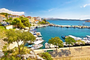 Photo of aerial view of Brodarica village near Sibenik beach and coastline, Dalmatia region of Croatia.