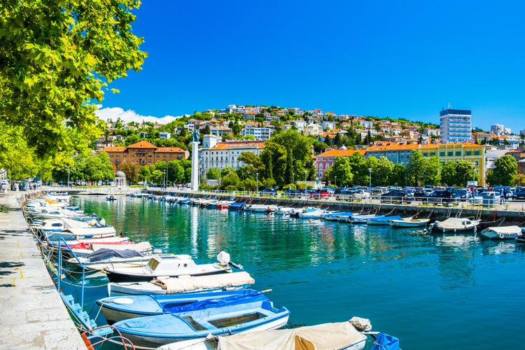 Photo of city of Rijeka, skyline view from Delta and Rjecina river over the boats in front, colorful old buildings, Croatia.