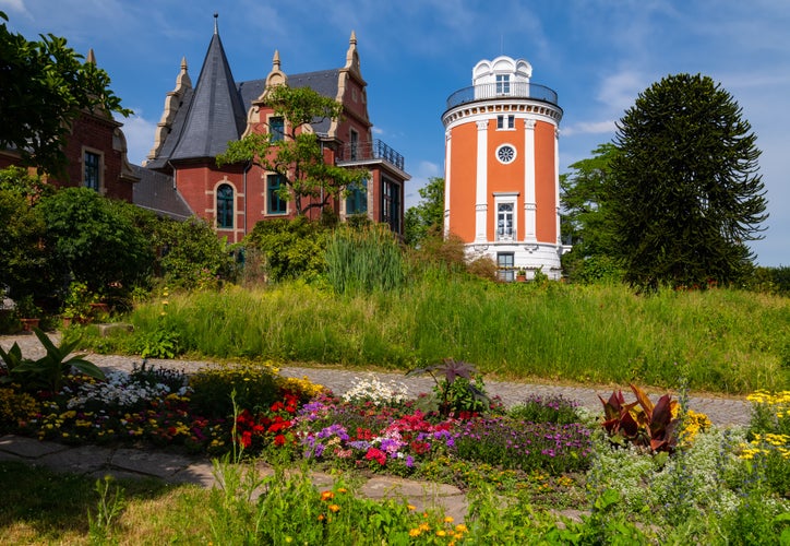 Botanical Garden in Wuppertal Germany with historic buildings on a sunny summer day. Flowers and trees with idyllic atmosphere. The “Hardt“ is a romantic public place on a hilltop above the city.