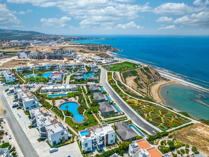 Photo of Kyrenia, North Cyprus - 25 May 2023: Luxury resort and residential complex in Esentepe, Kyrenia, North Cyprus on sunny day with clear sky.