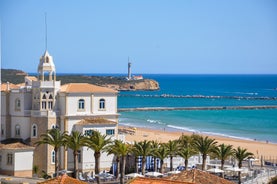 Photo of Carvoeiro fishing village with beautiful beach and colourful houses, Portugal.