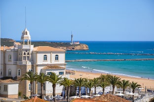 Photo of aerial view of touristic Portimao with wide sandy Rocha beach, Algarve, Portugal.