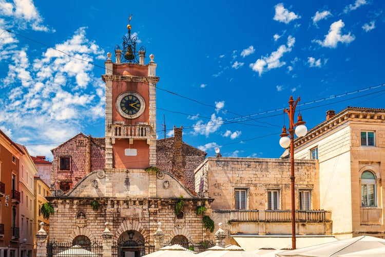 Photo of clock tower on the people's square in historic center of the Zadar town at the Mediterranean Sea, Croatia.