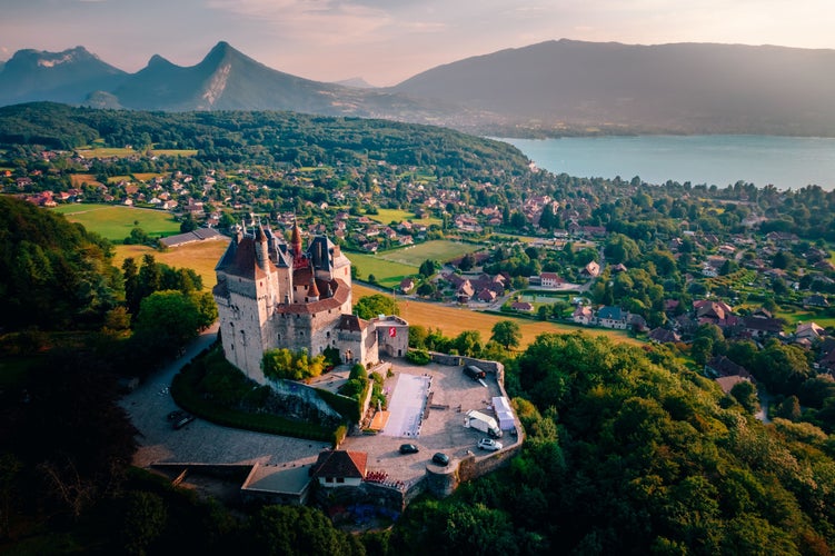 Photo of An aerial shot of the Castle of Menthon-Saint-Bernard overlooking the town and lake in Annecy, France .