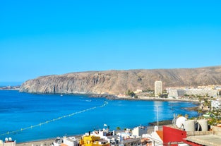 photo of aerial view of the beach and lagoon of Los Cristianos resort on Tenerife, Canary Islands, Spain.