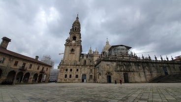 Photo of Facade of Santiago de Compostela cathedral in Obradoiro square, Spain.