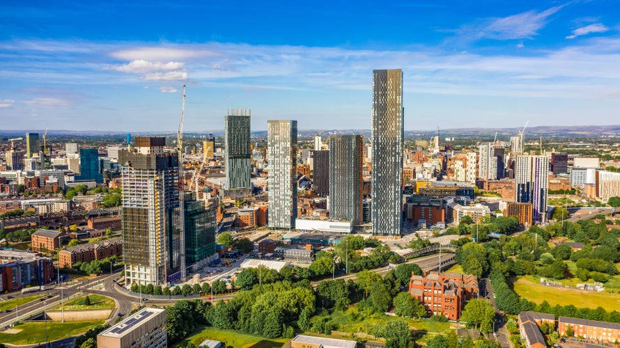 Photo of aerial shot of Manchester UK on a beautiful summer day.