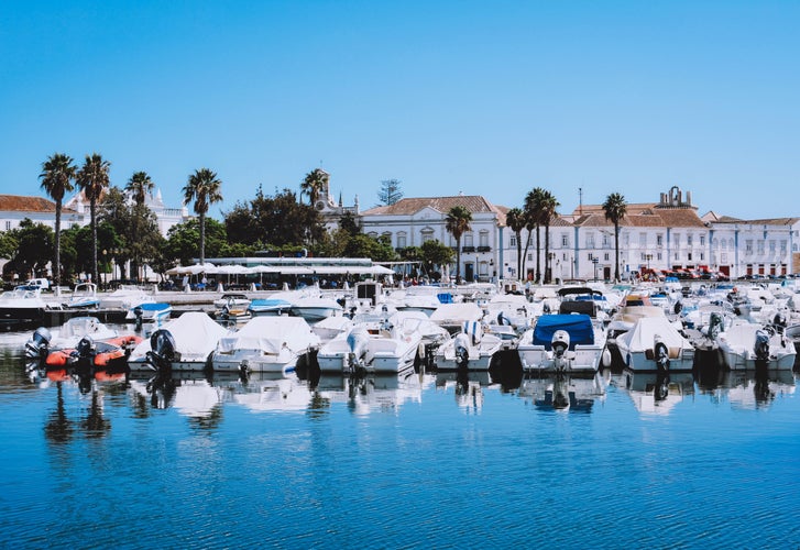 Photo of boats at the marina of Faro with clear blue sky Algarve, Portugal.