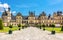 photo of the medieval Fontainebleau palace (Chateau de Fontainebleau) at beautiful summer in France.