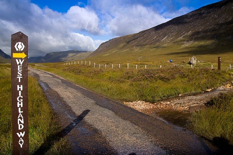 A wooden signpost marking the West Highland Way.jpg