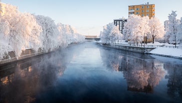 Rovaniemi Finland, panorama of the city with Kemijoki river in the back and Ounasvaara fell with the city heart at the left.