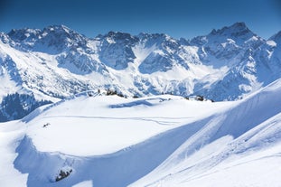 photo of village of Hirschegg in the Kleinwalsertal, Vorarlberg, Austria, with Gottesackerplateau in the background.