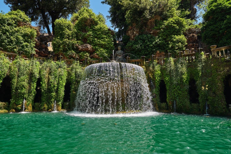 Magnificent fountain with turquoise water in the old park of Tivoli in Italy