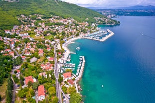 photo of aerial panoramic view of beautiful town of Lovran and sea walkway in Croatia.