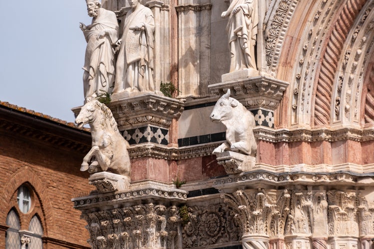 photo of view of Facade decoration of the cathedral of Siena, Italy.