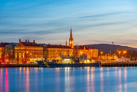 photo of view of Sunset cityscape of Sundsvall and a cultural center translated as Kultural Magasinet in Sweden.